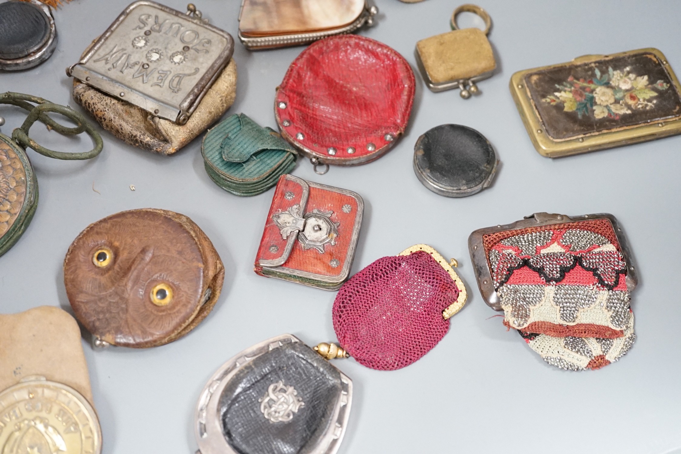 Mixed collection of mainly 19th century leather purses of various sizes and shapes, including two novelty ‘owl’ purses, a horse shoe shaped silver framed purse, cut steel purses, approx 39 in total